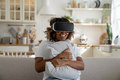 African American girl in VR helmet feeling insanely excited while watching 3d movie at home - PhotoDune Item for Sale