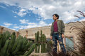 Man visiting the old rustic model school with cactus in Mineral de Pozos Guanajuato Mexico - PhotoDune Item for Sale
