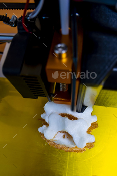 Modern 3D printer printing figure close-up macro 3d printer prints a vertebra