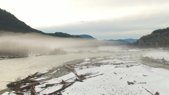 Aerial View of Chilliwack River with Snow During Winter Season