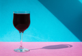 A glass of wine on a multicolored background. - PhotoDune Item for Sale