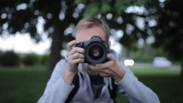 Photographer takes pictures on a digital camera