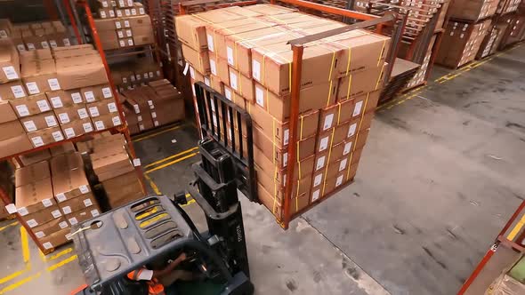 Birdseye View Of Forklift Truck With Boxes In Warehouse 2