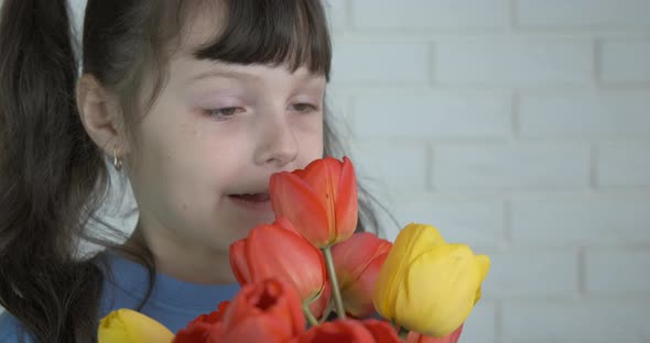 Little girl with flowers. 