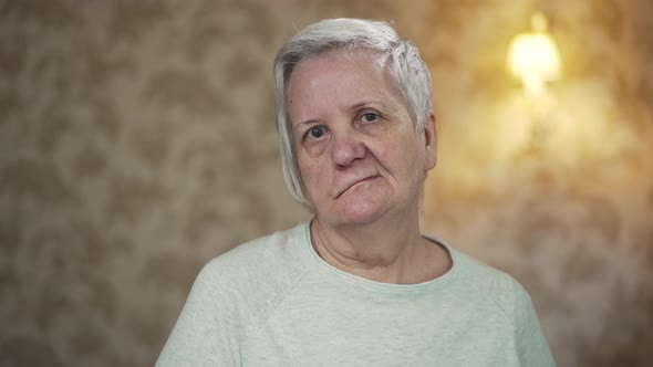 Elderly Woman with Facial Paralysis