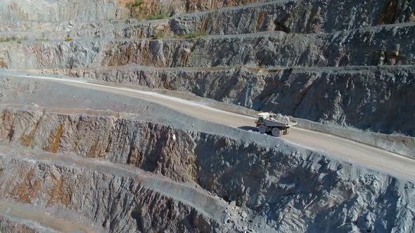 Large Vehicles Working Around a Large Open Quarry