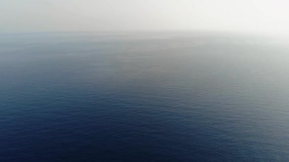 The Camera Flies Over the Calm Sea