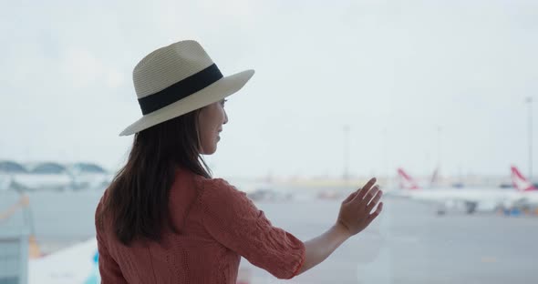 Woman Go Travel and Look at The Aircraft in The Airport
