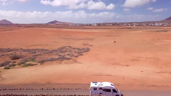 Drone panning a motorhome on its way to the sea