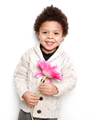 Cute child smiling with big pink flower - PhotoDune Item for Sale