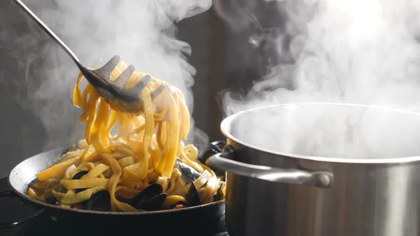 Chef Serving Pasta on Plate