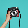 Hand with instant camera - PhotoDune Item for Sale