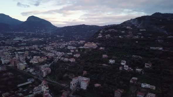 The Town of Sorrento in Italy, a beautiful landscape of houses near the bay of Naples at sunset or s