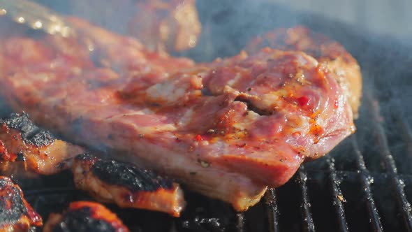 Close-up Chef Cuts a Freshly Baked Piece of Meat on the Grill