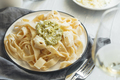 Homemade egg noodles with pesto sauce and grated parmesan cheese - PhotoDune Item for Sale