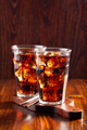 glass of cold cola soft drink with ice on wooden background - PhotoDune Item for Sale
