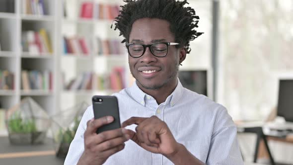 African Man Using Smartphone