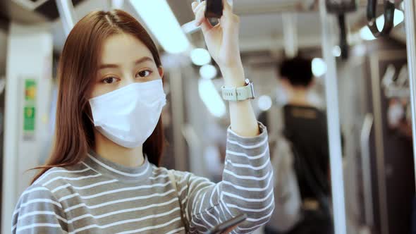 Young asian woman cover mouth , wear medical face mask to protect viruses