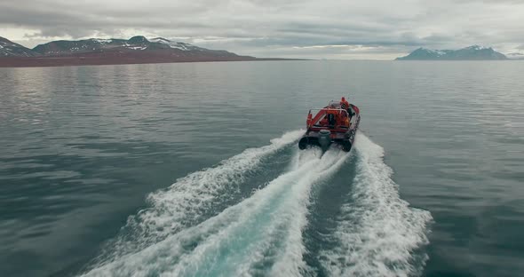 Beautiful View of the Arctic Ocean Area at the Coast of Svalbard with a Speedboat Moving Forward