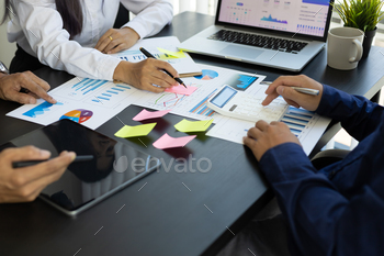 ng project the financial report paperwork in office. Teamwork concept, financial advisor, accounting and business planning, investment analysis.