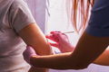 A girl doctor in pink gloves does a vaccination - PhotoDune Item for Sale
