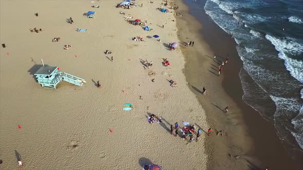 Venice beach California Drone shot panning right on beach front with sand and water