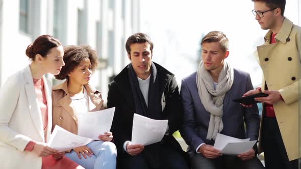 International Business Team with Papers Outdoors