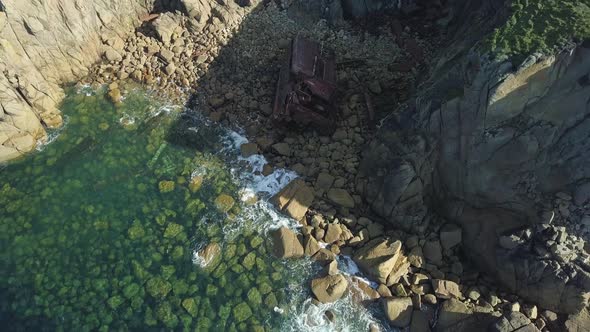 Old RMS Mulheim Shipwreck Lying On The Rocks At The Coast Between Land's End And Sennen Cove In Corn