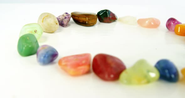 Close-up of colorful pebbles stones arranged in circle