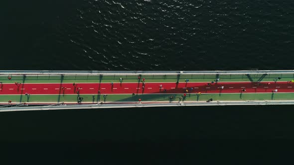 Marathon Running on the Footbridge. Top View Shot