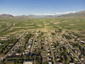 Aerial view of the village of Toguz Bulak, surrounded by farms in Kyrgyzstan. - PhotoDune Item for Sale