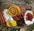 Detail shot of charcuterie table set up for lunch, with meats and cheeses in beautiful arrangement - PhotoDune Item for Sale