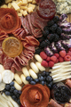 High angle view of beautiful charcuterie arrangement with meats, cheeses, and berries. - PhotoDune Item for Sale