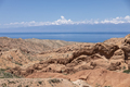 The beautiful wasteland of Skazka Canyon with Lake Issyk-Kul in the background in Kyrgyzstan. - PhotoDune Item for Sale