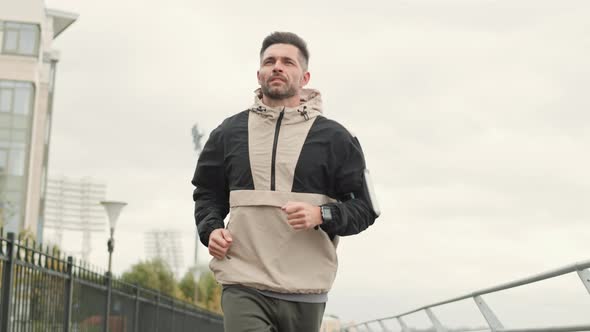 Middle-aged Sportsman Running Outdoors