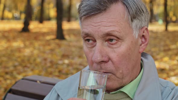 Close Up Outdoors Senior Old Retired Pensioner Mature Caucasian Man Looking Away Deep in Thoughts