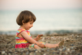 Toddler baby playing on a beach - PhotoDune Item for Sale