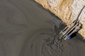 Aerial view of mining residual waters from a copper mine discharging into decanting pond - PhotoDune Item for Sale