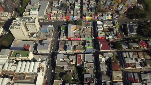 Scenic aerial wide drone shot above Bo-Kaap, Cape Town, South Africa. Tilt-up  with scenic view of B