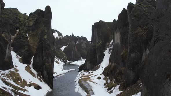 Aerial view of Fjardarargljufur canyon with river in wintertime, Iceland.