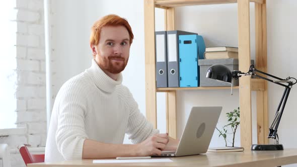 Man with Red Hairs Accepting Deal, Shaking Head to Agree