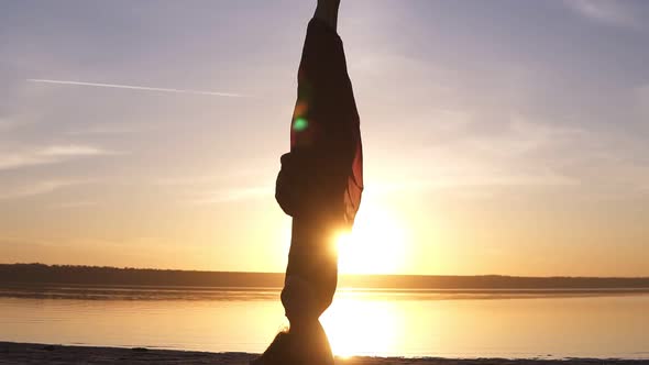 Close Up Footage of a Beautiful Girl Standing Stood on Her Head in Yoga Asana