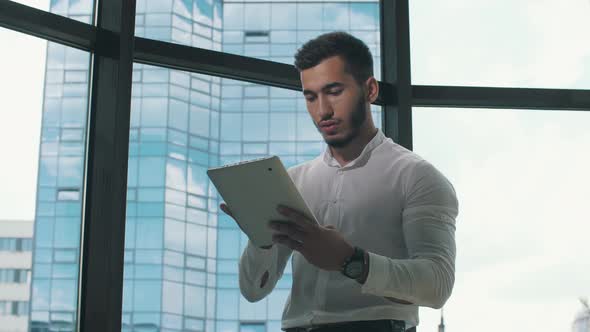 Businessman Using Digital Tablet at the Office