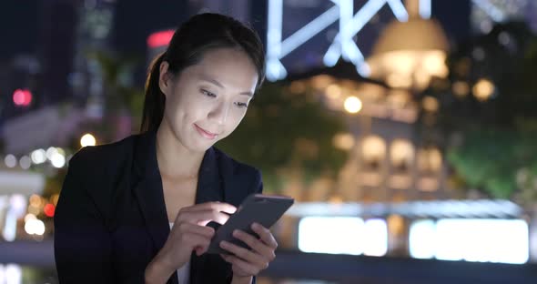 Woman use of cellphone at night 