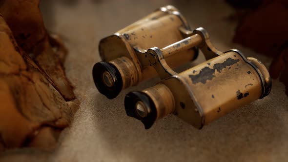 Old German Military Binoculars on the Sand Beach alt