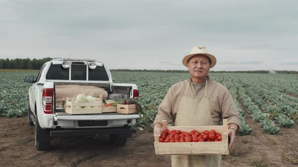 Farmer With Box Of Tomatoes