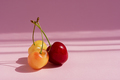 Cherry ripe on a pink background. - PhotoDune Item for Sale