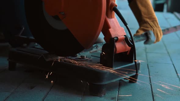 Professional Mechanic is Cutting Steel Metal