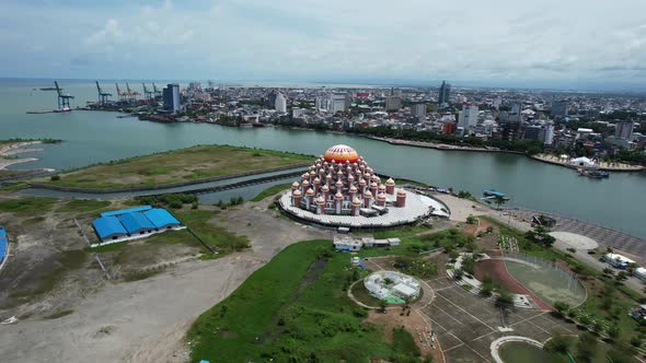 unique waterfront mosque with 99 orange domes in Makassar city Sulawesi indonesia along the water on