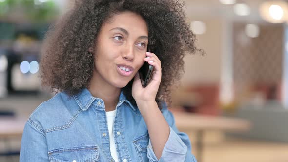 Happy African Woman Talking on Phone